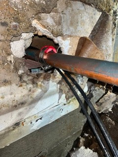 PipeBandit clamp used for in-wall copper pipe repair
